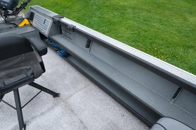 Slide: The Image of 2021 Alumaweld Super Vee 20 boat interior with seating and storage compartments. - 5