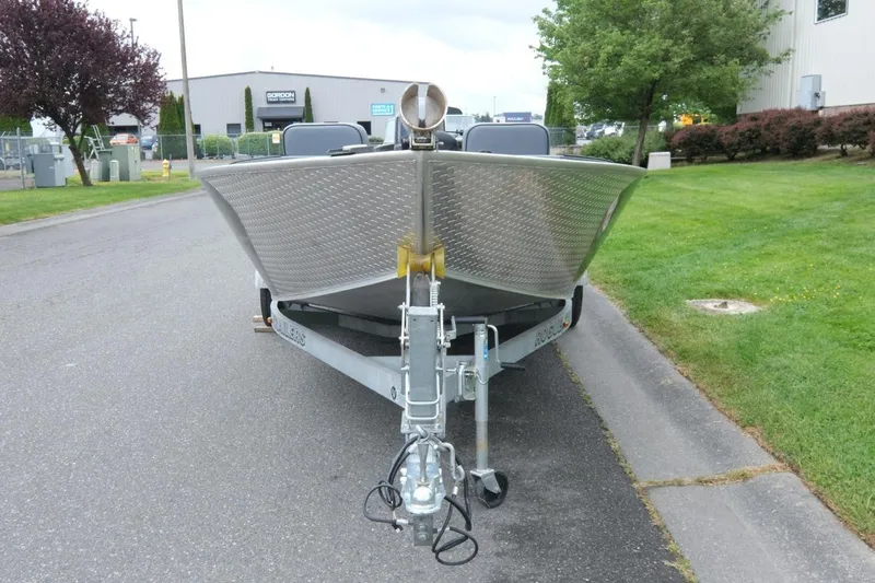 Slide: The Image of 2021 Alumaweld Super Vee 20 boat on trailer, parked on a street near greenery. - 7