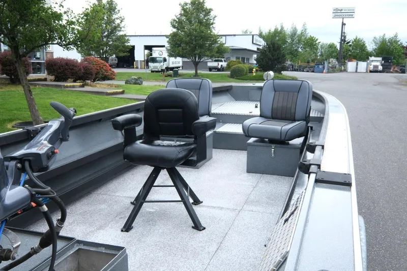 Slide: The Image of 2021 Alumaweld Super Vee 20 boat with comfortable seating, parked outdoors. - 8