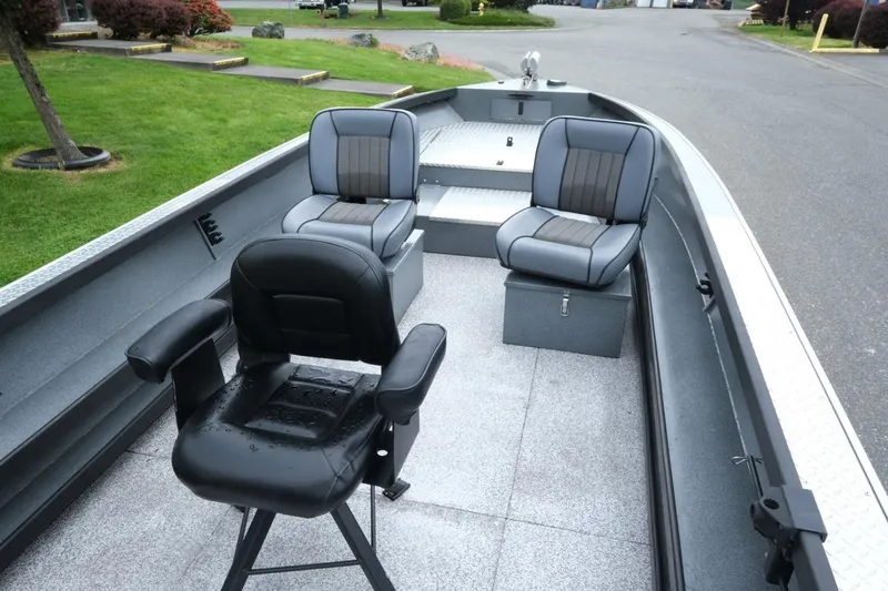 Slide: The Image of 2021 Alumaweld Super Vee 20 boat interior with three cushioned seats and spacious deck. - 9