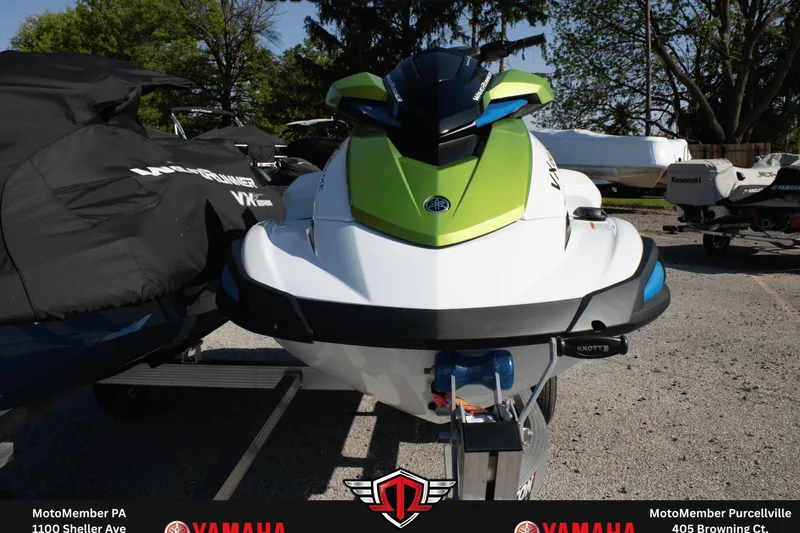 Slide: The Image of 2026 Yamaha WaveRunner VX Deluxe in vibrant green and white, parked outdoors. - 2