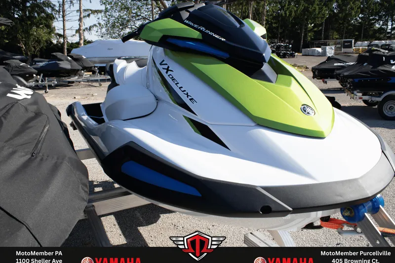 Slide: The Image of 2026 Yamaha WaveRunner VX Deluxe in vibrant green and white, displayed outdoors. - 3