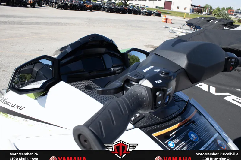 Slide: The Image of 2026 Yamaha WaveRunner VX Deluxe handlebar and dashboard close-up in a dealership lot. - 7