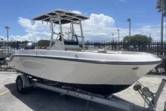 The Image of 2023 Trophy T22 boat on trailer under clear blue sky. - 1
