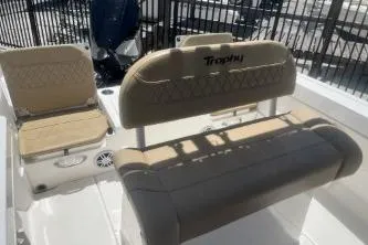 Slide: The Image of 2023 Trophy T22 boat interior with beige seating and modern design. - 11