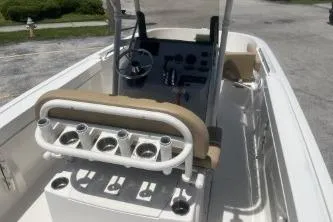 Slide: The Image of 2023 Trophy T22 boat interior with steering console and rod holders. - 8