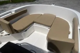 Slide: The Image of 2023 Trophy T22 boat interior with beige cushioned seating. - 9