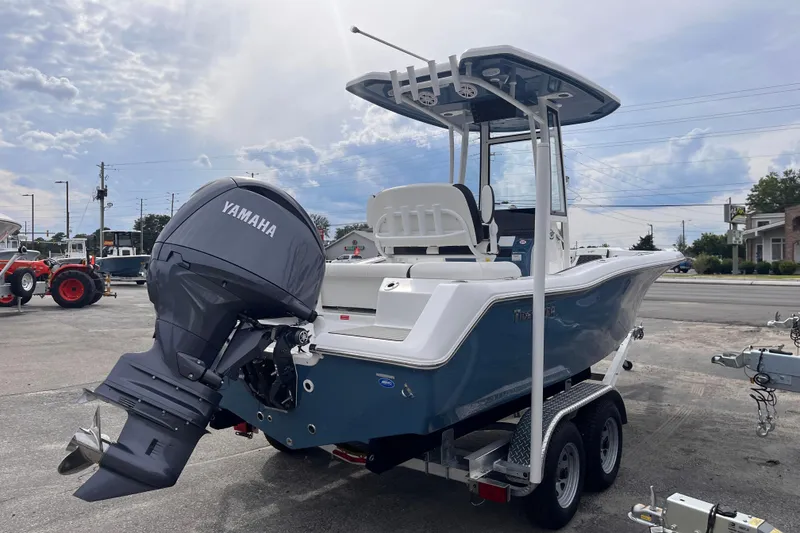 Slide: The Image of 2026 Tidewater 210 LXF boat with Yamaha engine on trailer, parked outdoors. - 4
