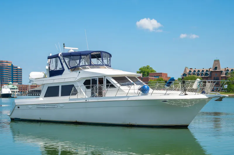The Image of 1999 Navigator 5300 yacht docked in sunny harbor. - 0