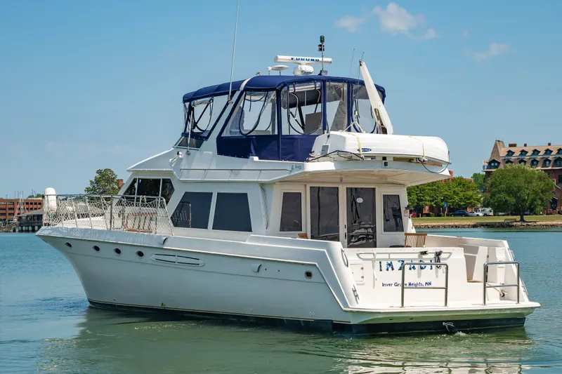Slide: The Image of 1999 Navigator 5300 yacht anchored on calm waters. - 3