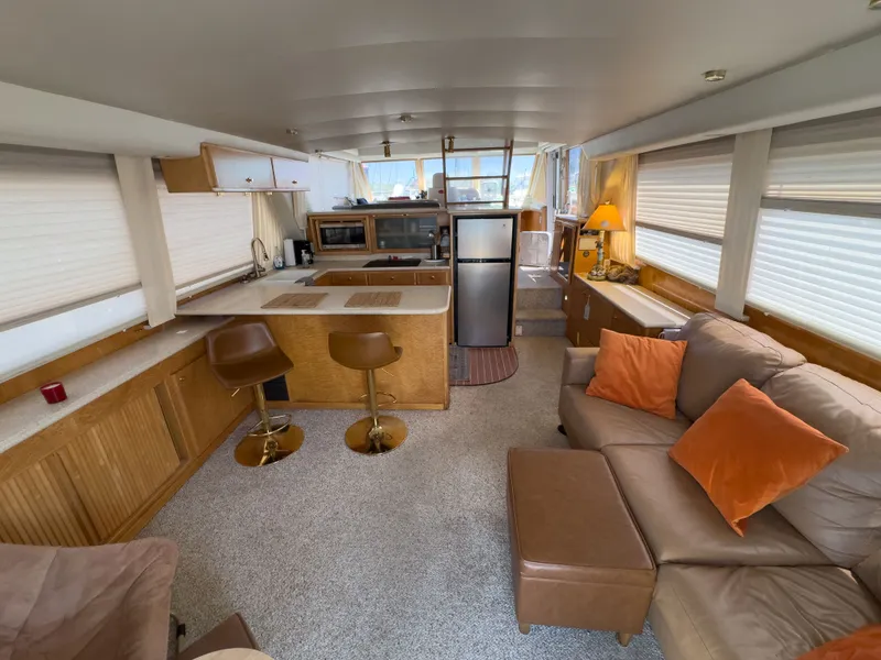 Slide: The Image of Interior of a 1999 Navigator 5300 yacht with cozy living area. - 32