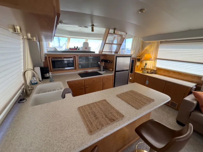Slide: The Image of Interior of a 1999 Navigator 5300 yacht with modern kitchen. - 35