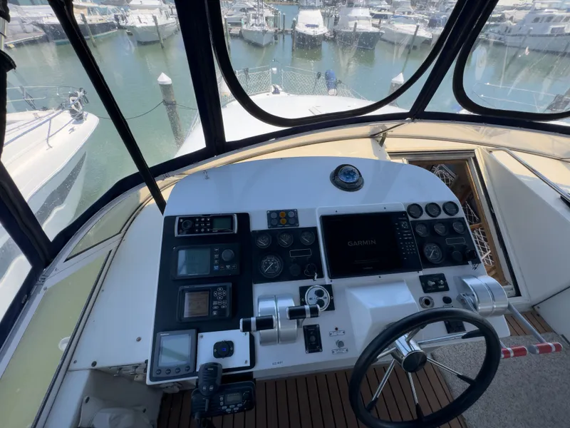 Slide: The Image of Helm of a 1999 Navigator 5300 yacht docked in marina. - 46