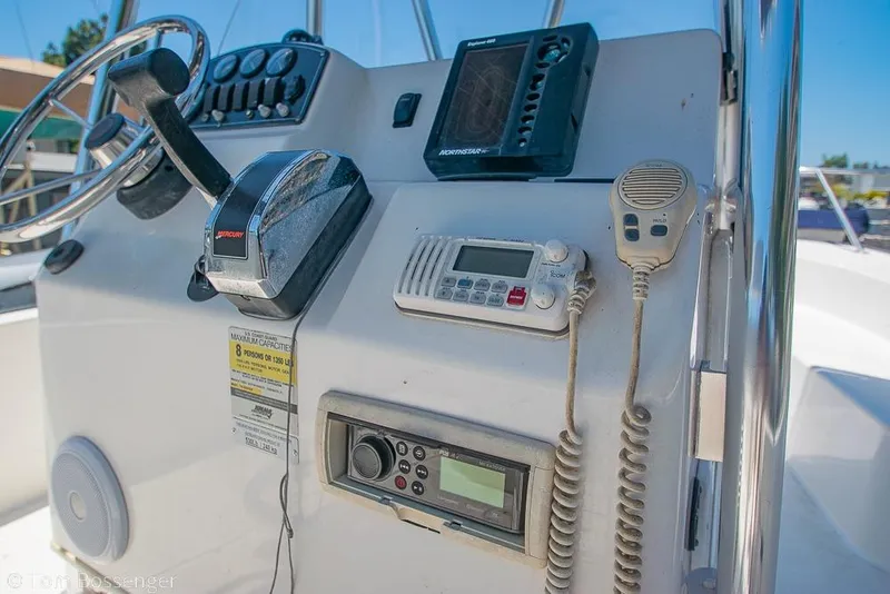 Slide: The Image of 2008 Boston Whaler 190 Montauk boat console with steering wheel and marine electronics. - 3