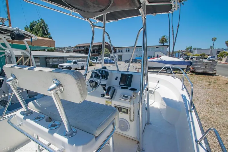 Slide: The Image of 2008 Boston Whaler 190 Montauk boat interior with steering console and seating. - 6