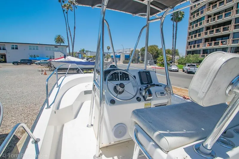 Slide: The Image of 2008 Boston Whaler 190 Montauk boat interior with steering console and seating. - 7