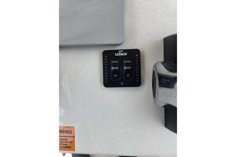 Slide: The Image of Lenco control panel on 2019 Parker 21 Special Edition boat dashboard. - 10