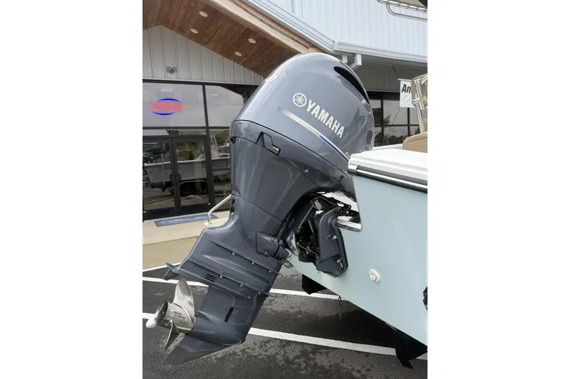 Slide: The Image of Yamaha outboard motor on Parker 21 Special Edition boat, 2019 model, parked outside dealership. - 2