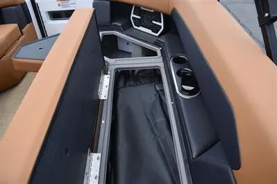 Slide: The Image of 2026 Princecraft Vouge 25 RL boat interior storage compartment with cup holders and seating. - 11