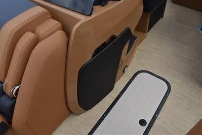 Slide: The Image of 2026 Princecraft Vouge 25 RL interior with tan seating and beige flooring. - 14