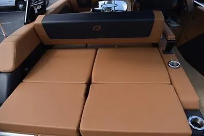 Slide: The Image of 2026 Princecraft Vouge 25 RL boat interior with luxurious tan seating and cup holders. - 52