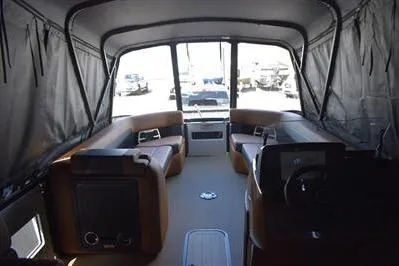 Slide: The Image of Interior view of 2026 Princecraft Vogue 25 RL boat with seating and covered canopy. - 60