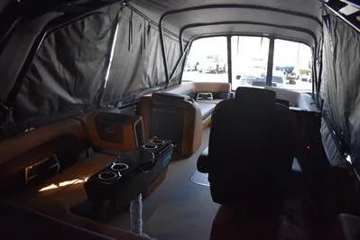 Slide: The Image of Interior of 2026 Princecraft Vogue 25 RL boat with seating and cup holders. - 62