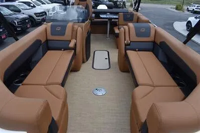 Slide: The Image of 2026 Princecraft Vouge 25 RL boat interior with luxurious tan seating and spacious layout. - 8