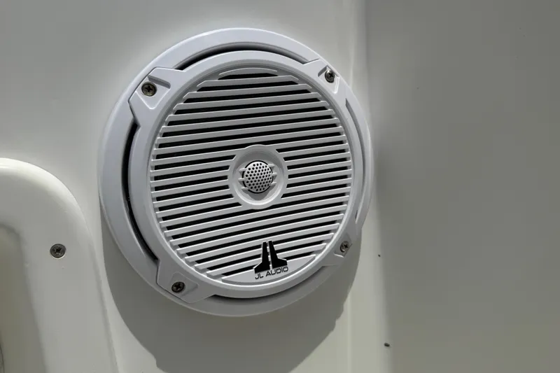 Slide: The Image of White JL Audio speaker on a 1996 Contender 23 CC boat. - 14