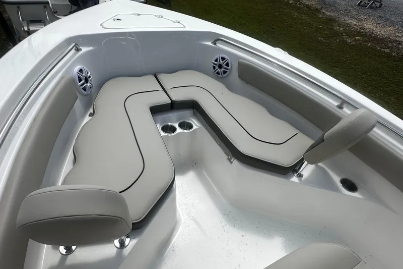 Slide: The Image of 2026 Key West 203 FS boat interior with cushioned seating and cup holders. - 10