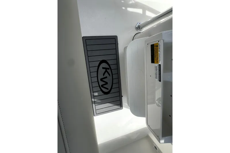 Slide: The Image of Key West 203 FS 2026 boat interior with KW logo on floor mat. - 3