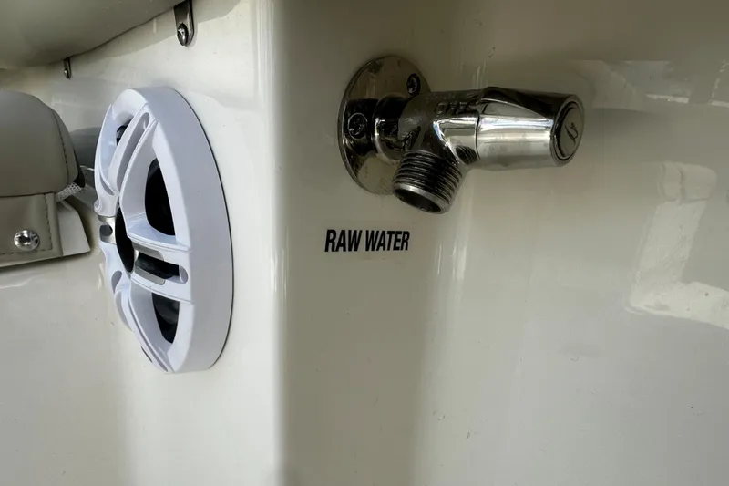 Slide: The Image of Key West 203 FS 2026 boat with raw water outlet and speaker detail. - 5