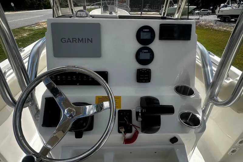 Slide: The Image of 2026 Key West 203 FS boat dashboard with Garmin navigation and Yamaha controls. - 7