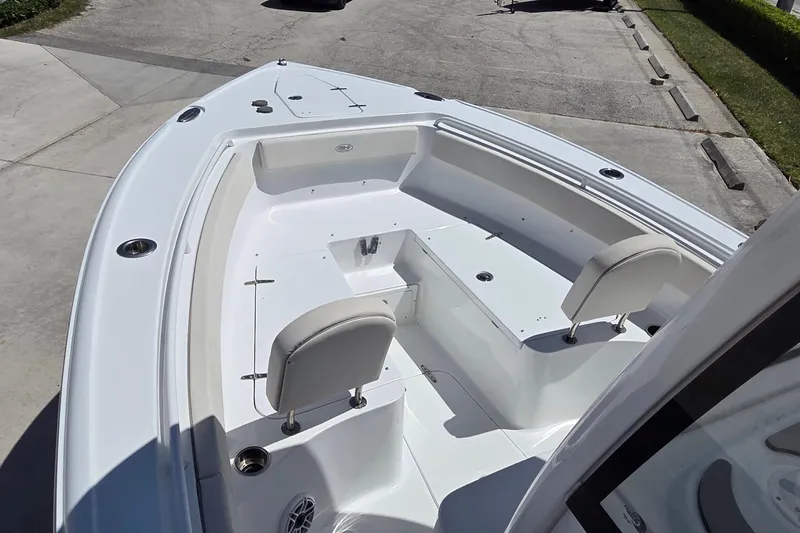 Slide: The Image of 2025 Sea Hunt Ultra 265 SE boat interior with seating and storage compartments. - 11