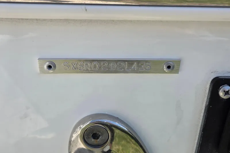 Slide: The Image of 2025 Sea Hunt Ultra 265 SE boat identification plate with serial number. - 12