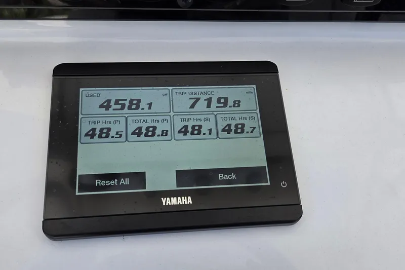Slide: The Image of Yamaha display showing fuel usage and trip data on Sea Hunt Ultra 265 SE, 2025 model. - 16