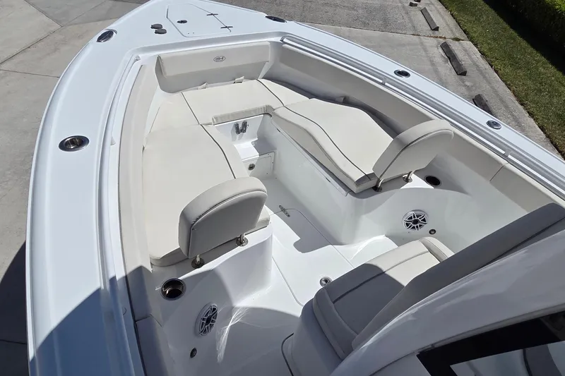 Slide: The Image of 2025 Sea Hunt Ultra 265 SE boat interior with cushioned seating and modern design. - 6