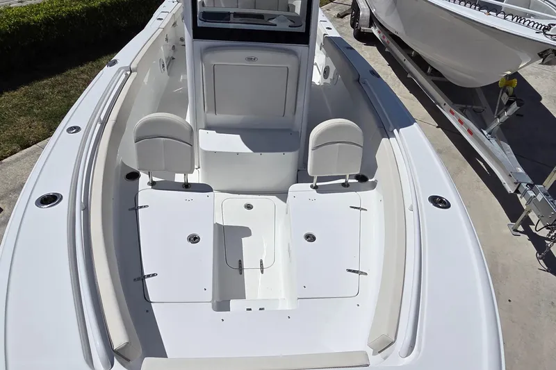 Slide: The Image of 2025 Sea Hunt Ultra 265 SE boat interior with seating and storage compartments. - 9