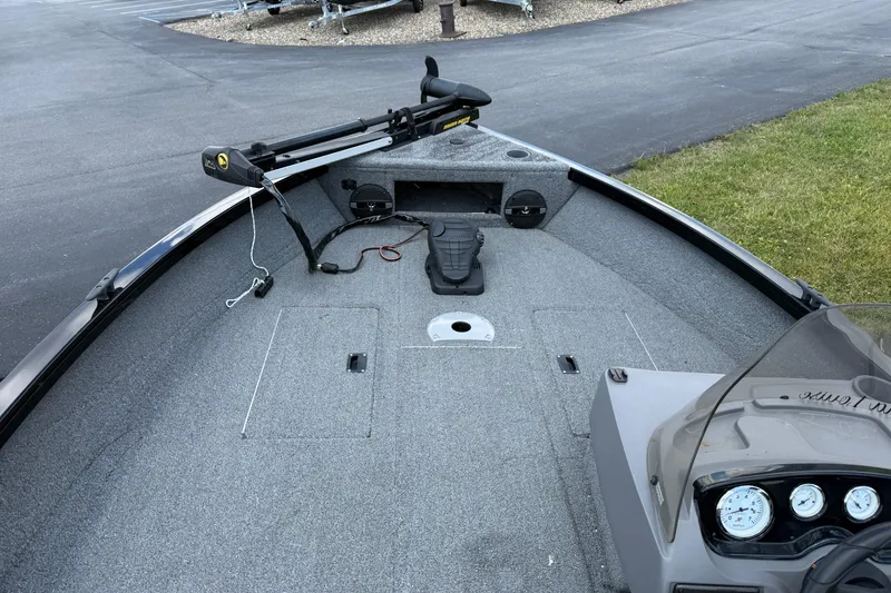 Slide: The Image of 2018 Crestliner 1650 Fish Hawk SC boat interior with trolling motor and dashboard. - 2