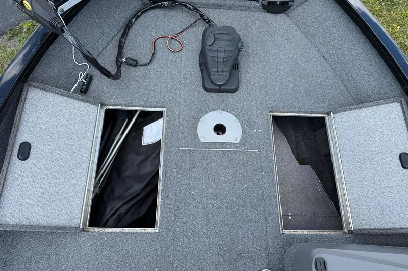 Slide: The Image of 2018 Crestliner 1650 Fish Hawk SC boat deck with open storage compartments. - 3