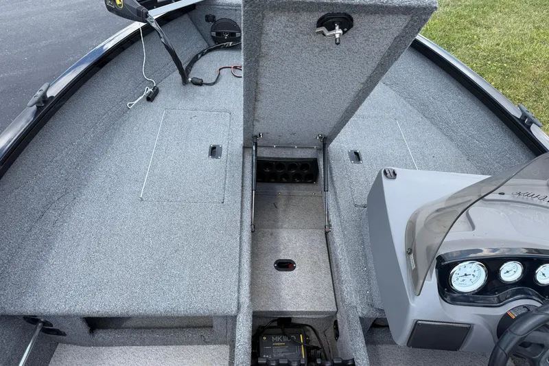 Slide: The Image of 2018 Crestliner 1650 Fish Hawk SC boat interior with open storage compartments. - 5
