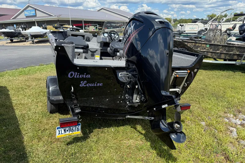 Slide: The Image of 2018 Crestliner 1650 Fish Hawk SC boat with Mercury engine, parked on grass. - 7