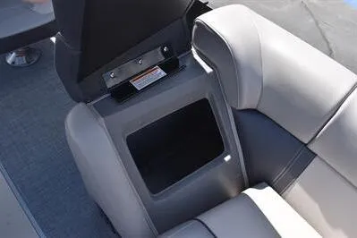 Slide: The Image of 2026 Princecraft Quorum 25 RL boat interior with gray seating and storage compartment. - 10