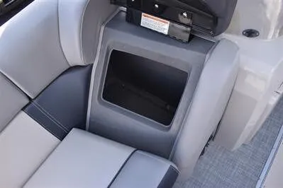 Slide: The Image of 2026 Princecraft Quorum 25 RL boat seat storage compartment, gray upholstery. - 11