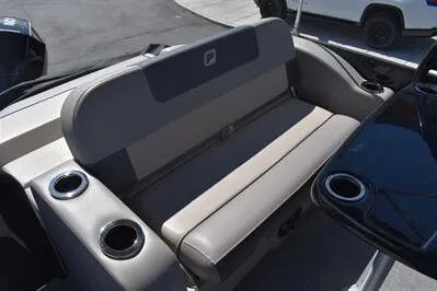 Slide: The Image of 2026 Princecraft Quorum 25 RL boat seating with cup holders, featuring sleek design and comfort. - 13
