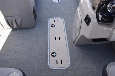 Slide: The Image of 2026 Princecraft Quorum 25 RL boat interior with sleek flooring and control panel. - 17