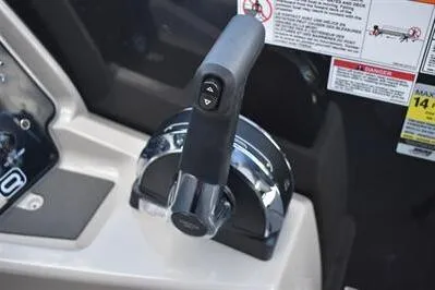 Slide: The Image of Throttle control of 2026 Princecraft Quorum 25 RL boat, featuring ergonomic design and safety labels. - 22