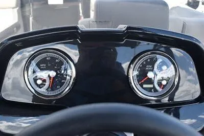 Slide: The Image of Dashboard of 2026 Princecraft Quorum 25 RL boat with dual gauges. - 26