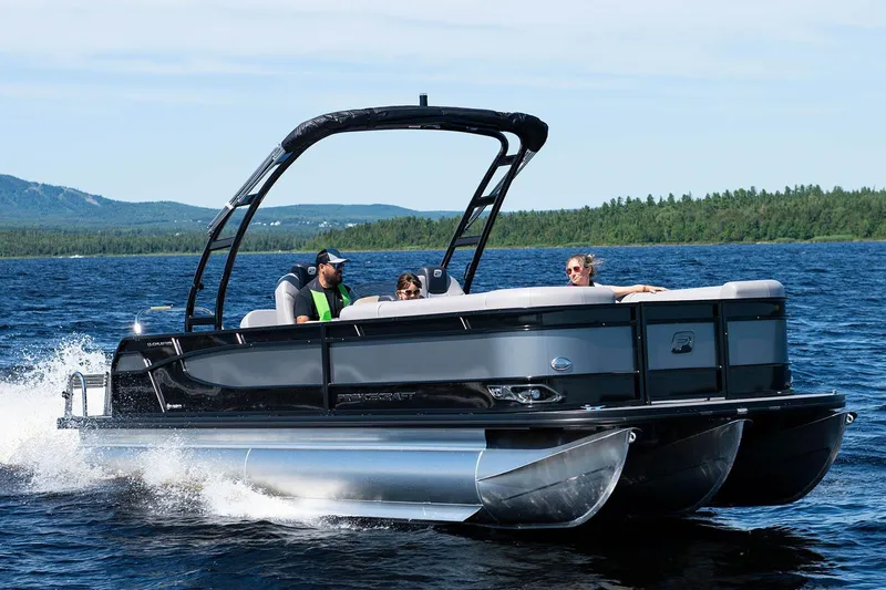 Slide: The Image of Manufacturer Provided Image: 2026 Princecraft Quorum 25 RL pontoon boat cruising on a scenic lake. - 39