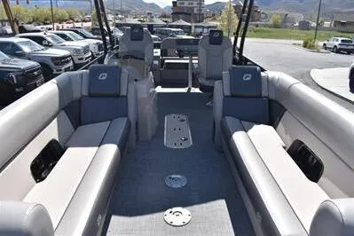 Slide: The Image of 2026 Princecraft Quorum 25 RL pontoon boat interior with spacious seating and modern design. - 7